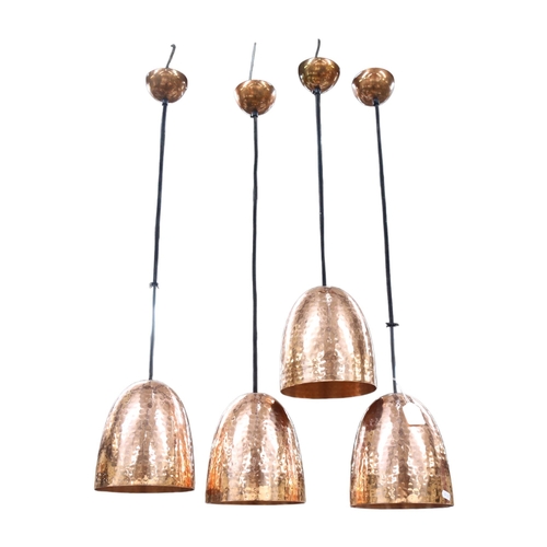 686 - A set of 4 hammered copper ceiling pendant lights, shade height 19cm