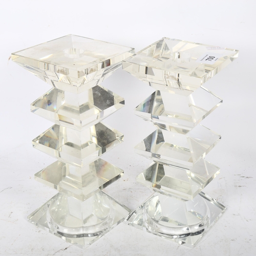 700 - A pair of heavy square cut-glass candlesticks, 22cm