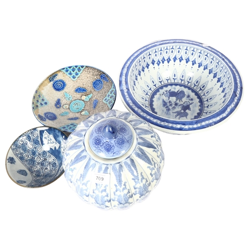 709 - A modern Chinese blue and white bowl, diameter 36cm, jar and cover, pottery bowl, and another with f... 