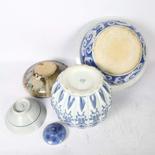 709 - A modern Chinese blue and white bowl, diameter 36cm, jar and cover, pottery bowl, and another with f... 