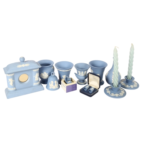 719 - Wedgwood Blue Jasperware clock, height 16cm, matching vases, candlesticks etc