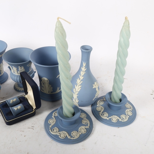 719 - Wedgwood Blue Jasperware clock, height 16cm, matching vases, candlesticks etc