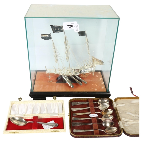 720 - A silvered metal model of a 3-masted sailing ship, in glass case, height 28cm overall, cased plated ... 