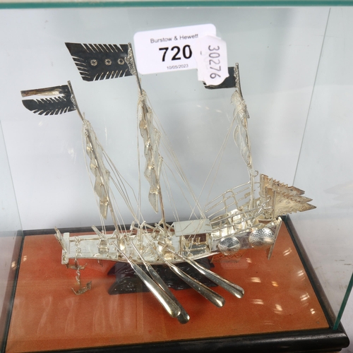 720 - A silvered metal model of a 3-masted sailing ship, in glass case, height 28cm overall, cased plated ... 