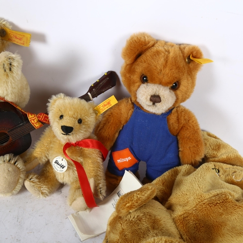 722 - A group of 4 Steiff teddy bears, including 1 with guitar, height 19cm