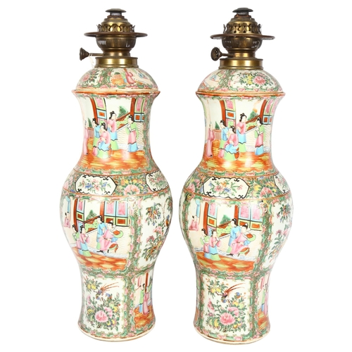 738 - A pair of large Chinese Canton famille rose ceramic baluster oil lamps, with hand painted and enamel... 