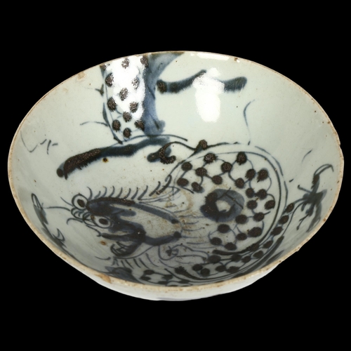 742 - A Chinese blue and white pottery 'Dragon' footed bowl, diameter 16cm