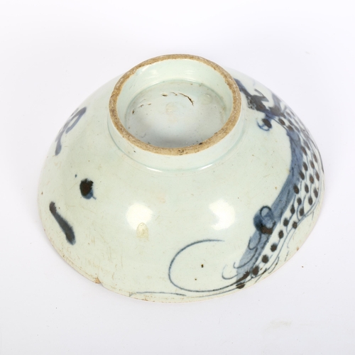 742 - A Chinese blue and white pottery 'Dragon' footed bowl, diameter 16cm