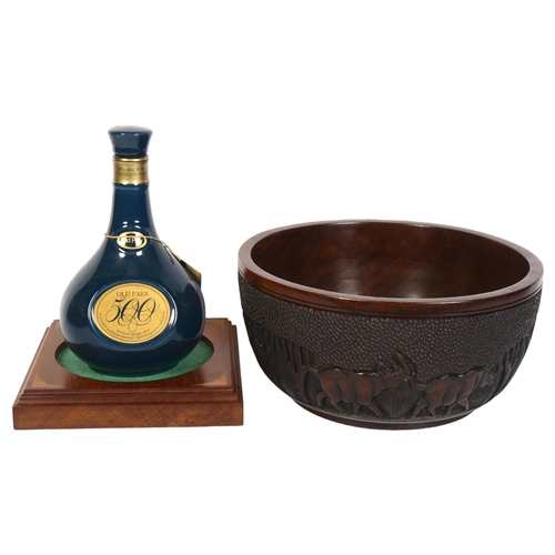 757 - Old Parr Scotch Whisky, with a carved hardwood bowl with design of elephants, 28cm diameter