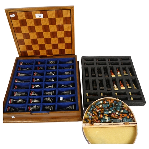 765 - A wooden-cased Franklin Mint Armada chess set, with pewter pieces, King height 6cm, a Peruvian chess... 