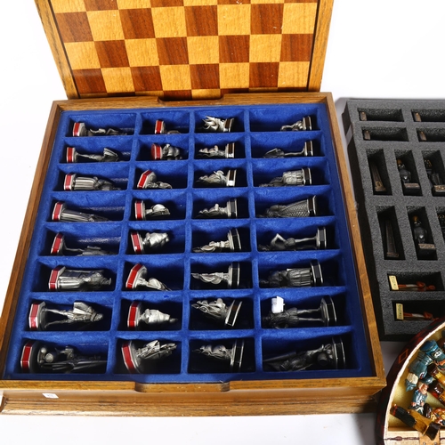 765 - A wooden-cased Franklin Mint Armada chess set, with pewter pieces, King height 6cm, a Peruvian chess... 