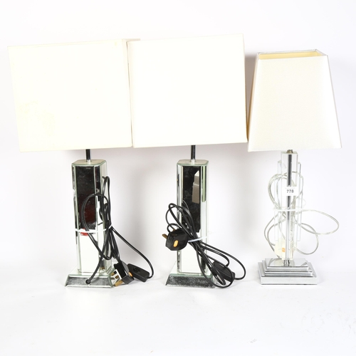 778 - A pair of table lamps with mirrored glass columns and cream shades, height 55cm overall, a table lam... 