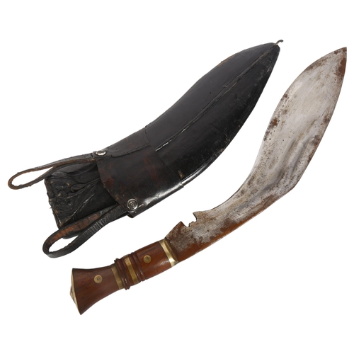 785 - A kukri knife and leather scabbard