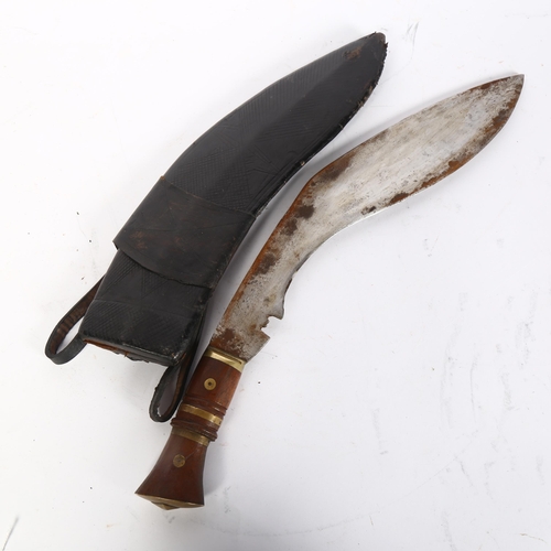 785 - A kukri knife and leather scabbard