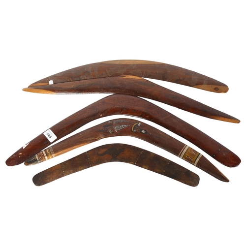 825 - A group of 5 Australian boomerangs, 3 with carved and painted decoration, longest 64cm