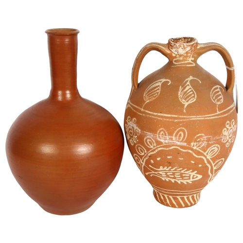 826 - A terracotta 2-handled vase with painted decoration, height 29cm, and a terracotta bottle vase