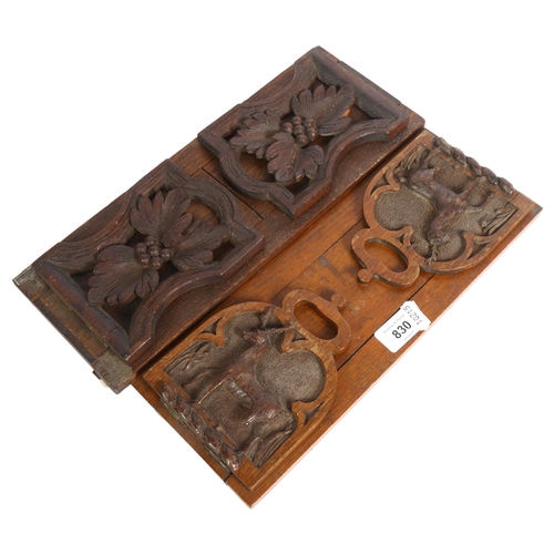 830 - 2 Black Forest extending bookracks, with designs of stags and flowers, length 34cm