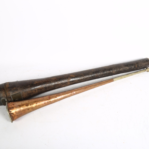 839 - Antique copper and brass horn, in fitted leather case with brass lock, length 76cm