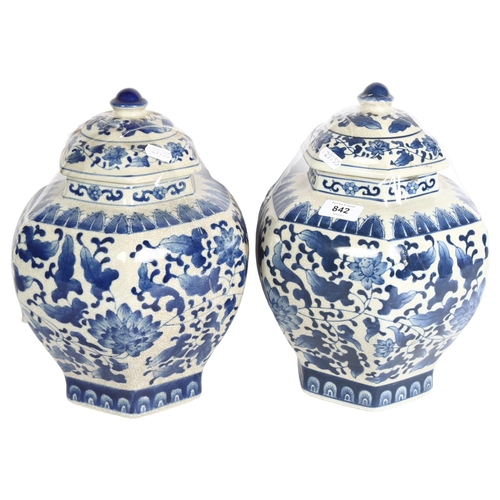 842 - A pair of Chinese blue and white crackle glaze jars and covers, height 32cm