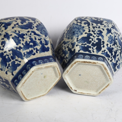 842 - A pair of Chinese blue and white crackle glaze jars and covers, height 32cm