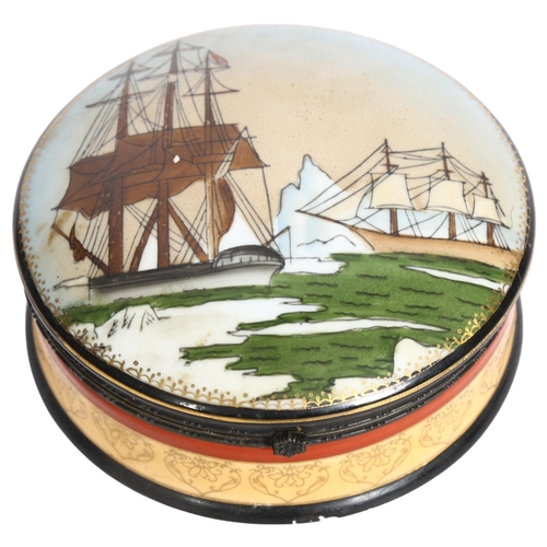 884 - A large circular porcelain box and cover, with printed ship design and gilded decoration, diameter 1... 