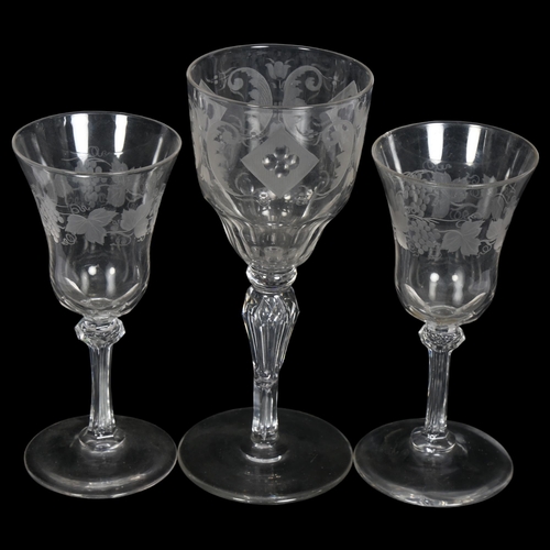 891 - A pair of cut-glass liqueur glasses, with thumb-cut bowls on chamfered stems, with leaf and grape en... 