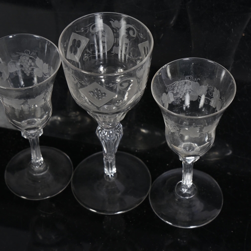 891 - A pair of cut-glass liqueur glasses, with thumb-cut bowls on chamfered stems, with leaf and grape en... 