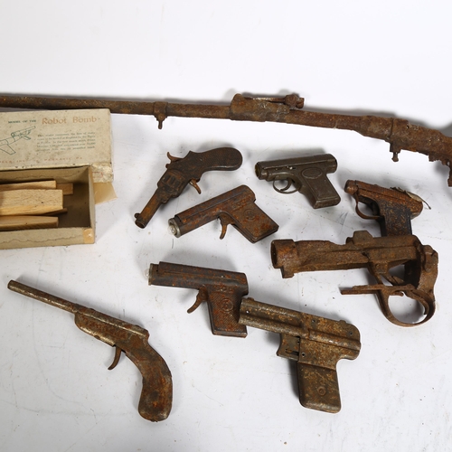 916 - A collection of Vintage pop guns, including a German Sole 560, a Wotan, an Austrian Oles Mains Browi... 