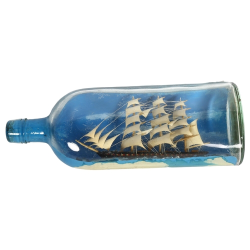 918 - A handmade ship in a bottle, length 30cm