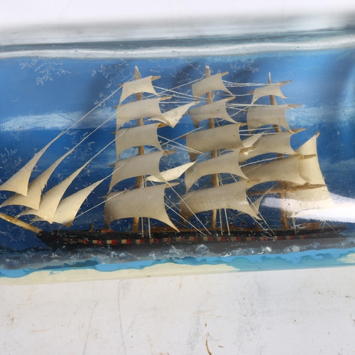 918 - A handmade ship in a bottle, length 30cm