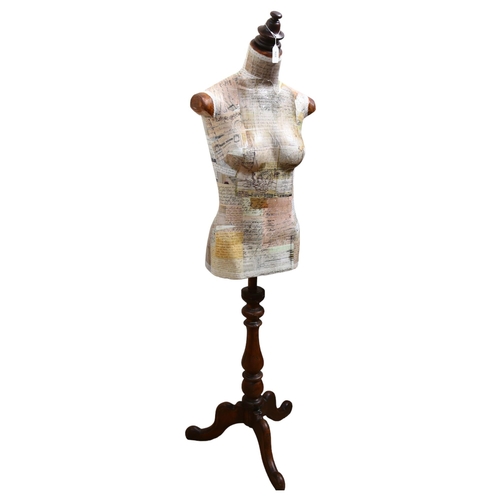 928 - Clive Fredriksson, a decoupage decorated half-size mannequin of the female form, on pine tripod stan... 