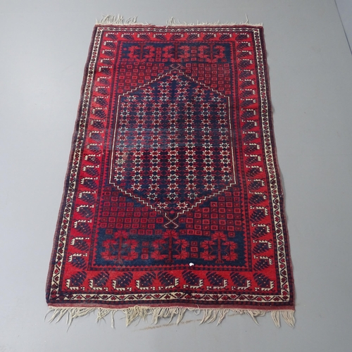 2315 - A red-ground Afghan rug. 183x115cm