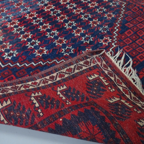 2315 - A red-ground Afghan rug. 183x115cm