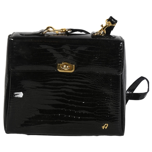 1040 - An Al Primo black leather handbag, height 24cm