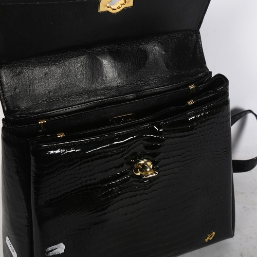 1040 - An Al Primo black leather handbag, height 24cm