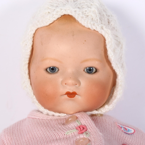 1042 - An Armand Marseilles porcelain-head baby doll, with jointed composition limbs, length 40cm