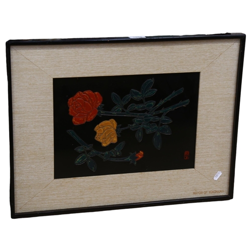 1052 - A Japanese black lacquer panel, depicting a still life of yellow and red roses, signed with seal mar... 