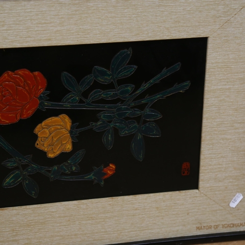 1052 - A Japanese black lacquer panel, depicting a still life of yellow and red roses, signed with seal mar... 