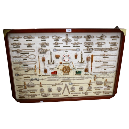 1053 - A framed display of various sailors knots, 63cm x 93cm overall