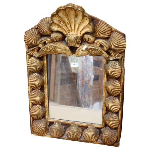 1062 - A painted plaster framed wall mirror, with oyster shell decoration, height 71cm, a label for Alan Wa... 