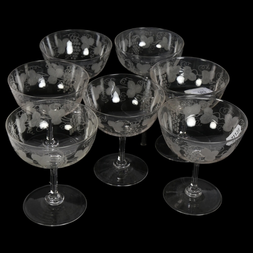 982 - A set of 7 Antique Champagne glasses, with etched grapevine design, height 10cm