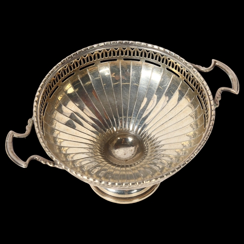 1245 - GOLDSMITHS & SILVERSMITHS COMPANY - a George V silver 2-handled bon bon dish, on turned foot, of sma... 