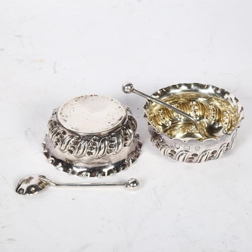 1249 - A Victorian silver salt set, comprising 4 salts with embossed decoration and 4 matching teaspoons, i... 