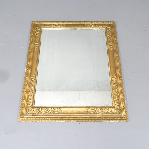 2218 - An antique continental gilt-wood framed over mantle wall mirror with carved decoration. 73x87cm.