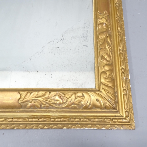 2218 - An antique continental gilt-wood framed over mantle wall mirror with carved decoration. 73x87cm.