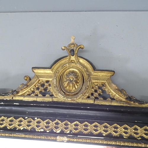 2219 - A large Victorian ebonised and gilt painted over-mantle wall mirror, with fluted pillars and applied... 