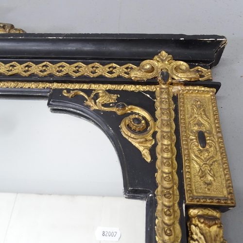 2219 - A large Victorian ebonised and gilt painted over-mantle wall mirror, with fluted pillars and applied... 