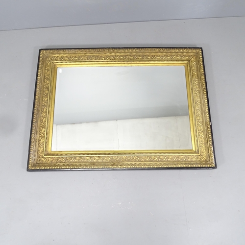 2223 - An antique continental ebonised and gilt painted bevelled-edge wall mirror. 116x85cm