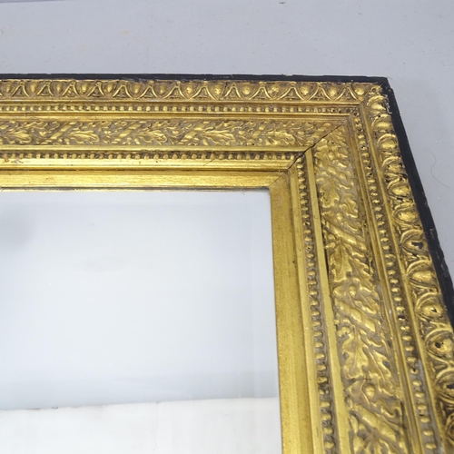 2223 - An antique continental ebonised and gilt painted bevelled-edge wall mirror. 116x85cm