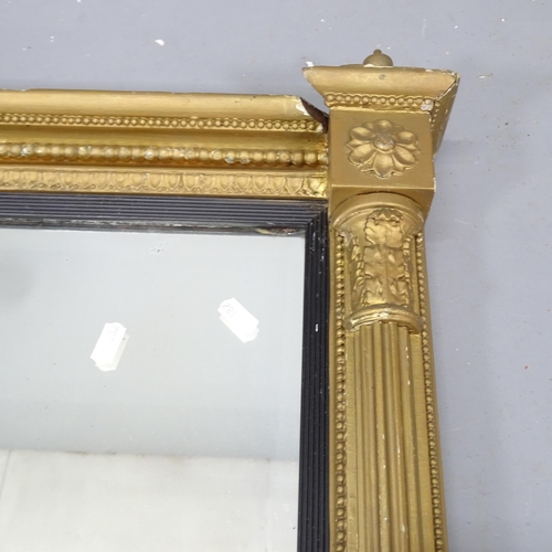 2227 - An antique gilt-gesso framed wall mirror. 64x99cm